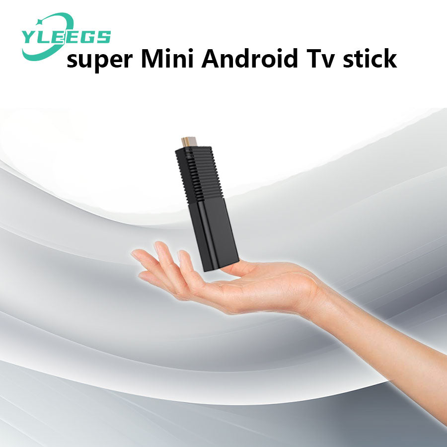 Compact YLEGS I96D1 mini Android TV stick held above a hand, showcasing its sleek black design and HDMI connector, perfect for transforming any TV into a smart streaming device with 4K support, WiFi connectivity, and Android OS for seamless entertainment.