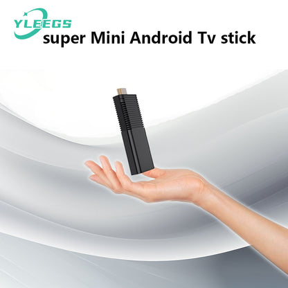 Compact YLEGS I96D1 mini Android TV stick held above a hand, showcasing its sleek black design and HDMI connector, perfect for transforming any TV into a smart streaming device with 4K support, WiFi connectivity, and Android OS for seamless entertainment.
